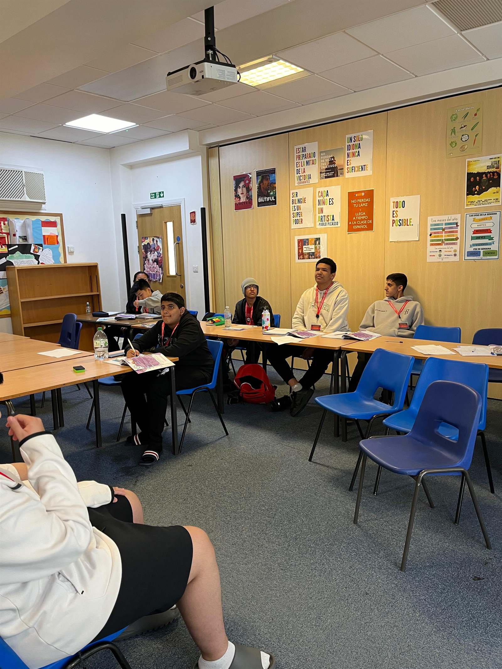 A London classroom with students seated around tables